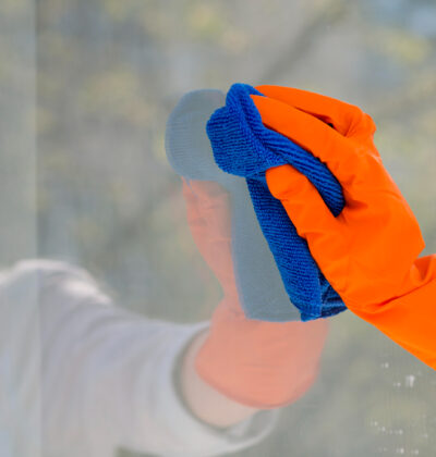 close-up-cleaning-window-with-cloth